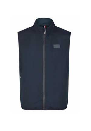 Gilet sans manches bleu marine en tissu lisse, avec un col haut, une fermeture éclair sur le devant et des panneaux latéraux en maille. Inclut un patch logo sur la poitrine.