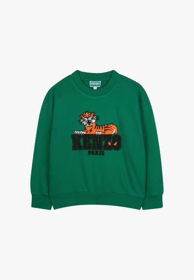 Zielona bluza ze okrągłym dekoltem. Posiada haftowaną grafikę tygrysa w kolorze pomarańczowym i czarnym oraz napis "KENZO PARIS" poniżej. Miękki materiał.