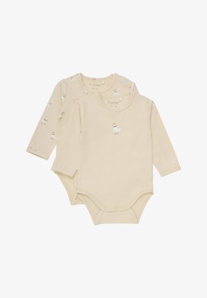 Långärmade bodysuits i ljusbeige bomull med små ankdesser. Har tryckknappar i botten och mjuka ribbade halslinningar.