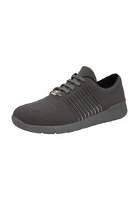 Gray athletic shoes made of breathable knit fabric. Features textured upper, gray laces, and white horizontal stripes on sides. Flexible sole.