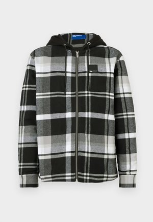 Black, white, and gray plaid zip-up jacket with black hood and drawstrings, long sleeves, and a small logo patch on the chest.