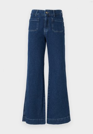 Široke traperice tamnoplave boje s visokim strukom, dva stražnja džepa i blagim ulaganjima na rubovima za jedinstveni završetak.