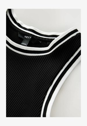 Black ribbed tank top with a round neckline, featuring white and black striped accents along the collar. Brand label visible inside.