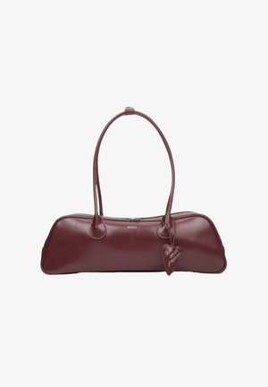 Burgundy leather handbag with two rounded handles, rounded edges, zip closure, and a decorative tag attached. Smooth texture.