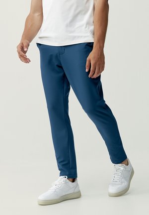 GANGES - Tracksuit bottoms - azul oscuro