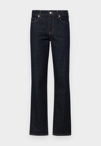 Tmavě modré zvonové džíny vyrobené z denimu. Obsahují pět kapes, viditelné švy v kontrastní oranžové barvě a přední zapínání na knoflík.