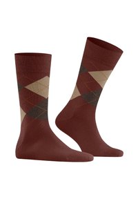 Calcetines marrones con un patrón argyle en tonos de beige, marrón oscuro y óxido, con costuras en contraste. Fabricados con un material suave y elástico.