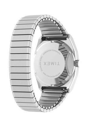 Timex-ur med rustfrit stål udvidelig rem, der viser bagsiden indgraveret med mærke, automatisk urværk og 50 meters vandmodstand.