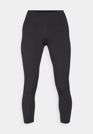 Sorte leggings med høj talje, lavet af glat, strækbart materiale. Har flade sømme og en tætsiddende pasform.