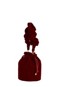 Red velvet drawstring bag with scrunched handles, gold hardware accents, and a rounded shape. Smooth texture and soft, plush finish.