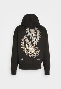 Felpa nera con un grande motivo paisley in metallo sul retro. Presenta un cappuccio con cordino e polsini e orlo a costine. Materiale morbido.