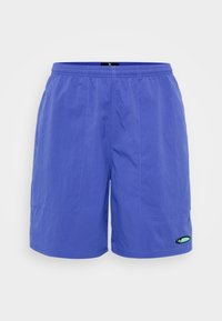 Blue shorts made from lightweight fabric, featuring an elastic waistband, two front pockets, and a small green logo tag on the lower left side.