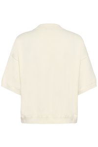 Īsām piedurknēm, krēmkrāsas adīta krekla ar brīvu pieguli un plakanu apkakli attēls no aizmugures uz baltas fona.