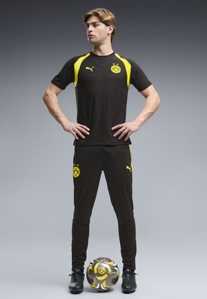 Puma, BORUSSIA DORTMUND SLIM TRAININGSHOSE - Fanartikel - black-faster yellow