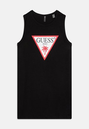 Crna majica bez rukava od pamuka, s velikim bijelim i crvenim trokutastim logotipom s natpisom "GUESS BEACH" i grafikom palme.