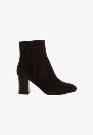 Black suede ankle boot with a pointed toe and a chunky wooden heel. Smooth texture, minimal design, and mid-height shaft.