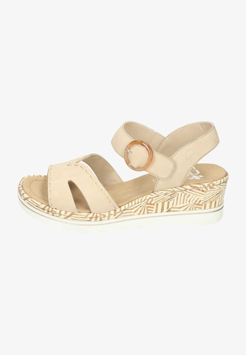 Beige leather sandals with two upper straps, circular accent, and a patterned wedge sole. The outsole is white, providing a cushioned base.
