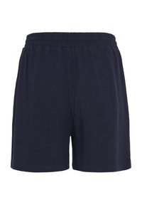 Námornícke modré šortky s elastickým pásom, vyrobené z ľahkej tkaniny, s voľným strihom a hladkou textúrou.