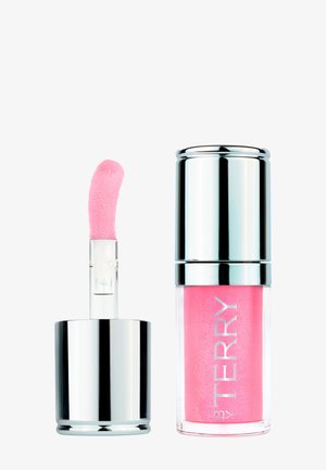 Contenant de gloss à lèvres avec un bouchon argenté brillant, corps transparent dévoilant un gloss rose, et applicateur avec embout rose incliné à côté.