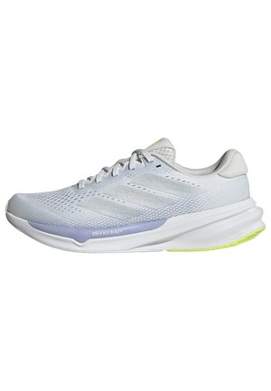 White athletic shoe with a breathable mesh upper, textured design, and lavender accent. Features a cushioned sole with green outsole details.