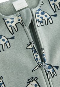 Next - Śpioszki
