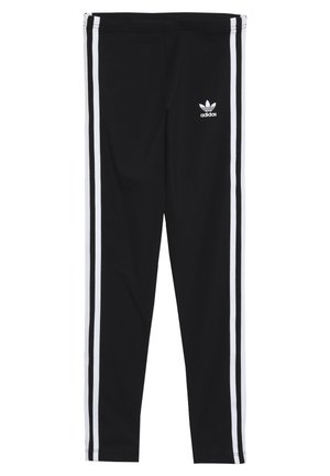 Leggings negros hechos de un tejido elástico, con dos rayas blancas verticales a cada lado y un pequeño logo blanco de Adidas en la parte frontal.