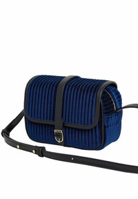 Navy blue corduroy crossbody bag with black leather accents, rectangular shape, fold-over flap, and adjustable strap.