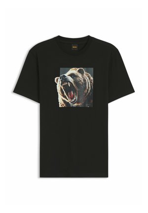 T-shirt nera in cotone con maniche corte. Presenta una grafica di un orso al centro, che mostra la texture del pelo e una bocca aperta. Marchio visibile sotto.