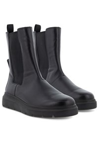 Bottines en cuir noir avec des panneaux latéraux élastiques et une semelle texturée, présentant une finition lisse et une languette à l'arrière pour un enfilage facile.