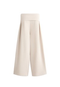 Beige wijde broek met een vlakke tailleband, textuurstof en geplooide details, die een losse pasvorm biedt en tot halverwege de kuit reikt.