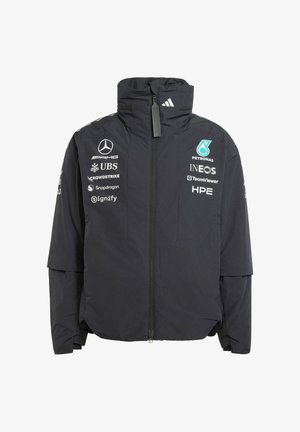 Veste noire zippée avec col haut arborant les logos Mercedes, Petronas, INEOS et d'autres sponsors sur le devant et les manches.