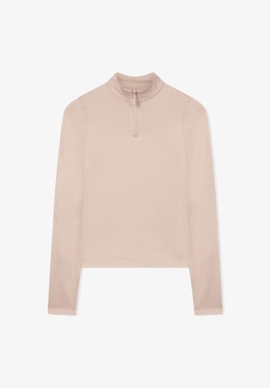 Beżowy crop top z długim rękawem, z wysokim kołnierzem i półzamykiem z przodu, wykonany z gładkiego materiału.