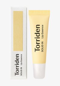 Torriden Solid In Lip Essence, gul tube, klar base, med hvid boks. Har sort tekst og en glat, mat tekstur.