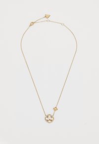 Gold chain necklace featuring a floral pendant with clear gemstones, intricate design, and an adjustable clasp. Elegant and textured detail.