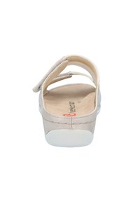Light grey suede sandal with a back strap and two adjustable top straps, featuring a cushioned insole and a white rubber sole.