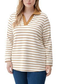 Long-sleeve polo shirt in cream with horizontal mustard stripes, featuring a V-neck and a contrasting collar. Soft, textured fabric.