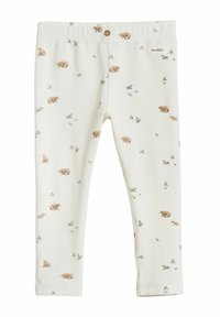 Bomull leggings i krämvit med en texturerad, våffelmönster. Har ett tryck av björn och blommor. Elastisk midja med en knappdetalj.