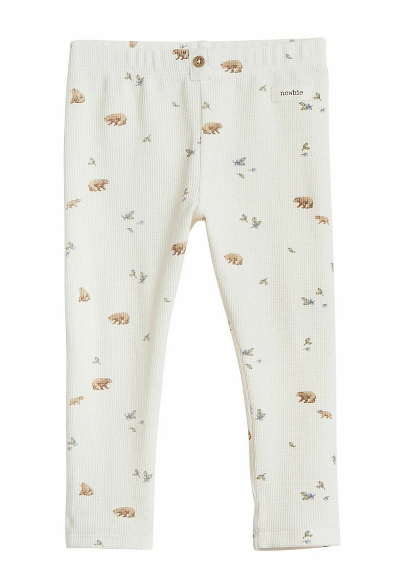Bomull leggings i krämvit med en texturerad, våffelmönster. Har ett tryck av björn och blommor. Elastisk midja med en knappdetalj.