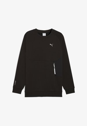 Juodas džemperis su apvali iškirpte, su priekyje esančia užtrauktuko kišene ir sidabriniu logotipu. Pagamintas iš minkštos medžiagos su tekstūriniu paviršiumi.