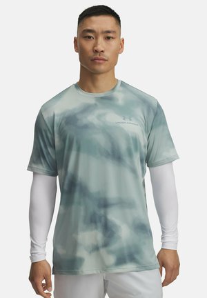 Light green athletic t-shirt with a subtle abstract pattern, short sleeves, and a crew neck. Features the Under Armour logo in gray.