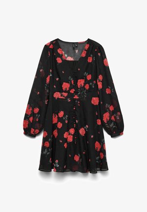 Musta kukkainen mekko, jossa pitkät hihat, punaisia ruusuja ja vihreitä lehtiä. V-pääntie, napitettu etuosasta, kevyt läpikuultava kangas.