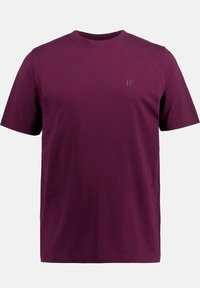 T-shirt a maniche corte di un profondo bordeaux, realizzato in cotone. Presenta un collo rotondo e un sottile logo "JP" di una tonalità più chiara sul petto.