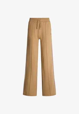 Beige weite Hosen aus weichem Stoff, mit einem elastischen Bund und einem Kordelzug sowie seitlichen Streifen in kontrastierenden Farben.