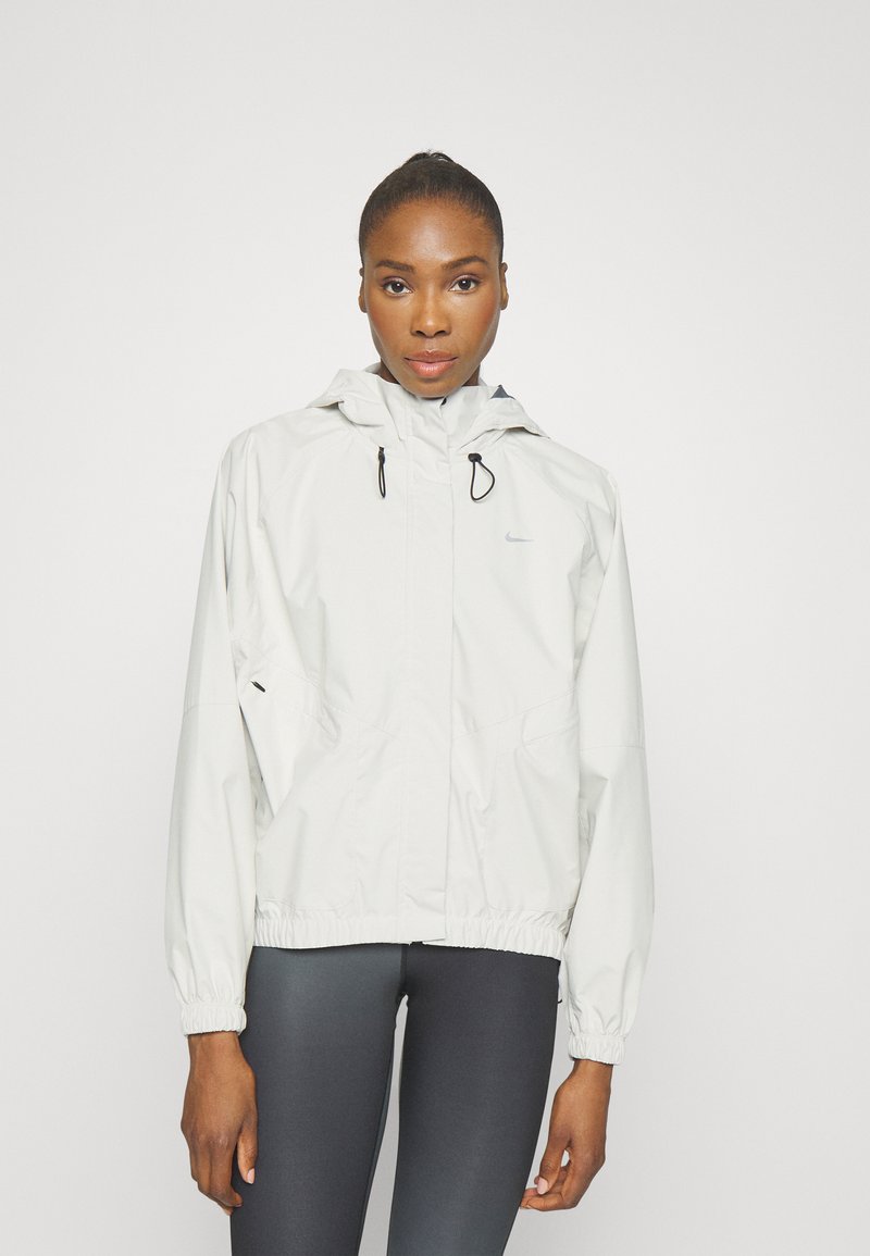 Nike Performance STORM-FIT SWIFT - Running jacket - pale ivory/black/silver