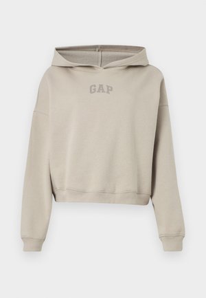Béžová krátka mikina s dlhými rukávmi a predným logom "GAP", zobrazená na bielom pozadí.