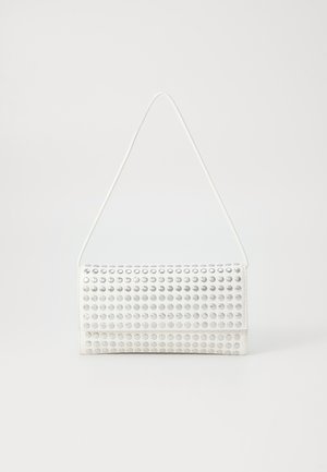White handbag with a rounded shape, featuring a textured surface of silver studs. It has a thin shoulder strap and a sleek closure.