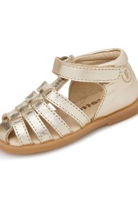 Złote skórzane sandały z otwartym noskiem, posiadające skrzyżowane paski i rzep przy kostce. Płaska gumowa podeszwa i wewnętrzna wyściółka.