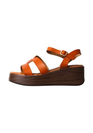Brown wedge sandal with wide orange leather straps and adjustable ankle buckle on white background.
