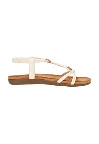Sandale plate blanche avec des straps tressés et un soutien de cheville. Semelle intérieure douce et texturée avec une semelle en caoutchouc brun et un minimum de détails.
