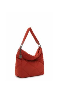 Quilted red handbag with a soft texture, featuring a wide shoulder strap and metallic chain accents. Distinctive diamond pattern on the surface.